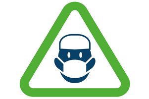 Icon: Gesicht mit Mundschutz und OP-Haube im grünen Warndreieck